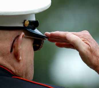 elderly man doing hand salute